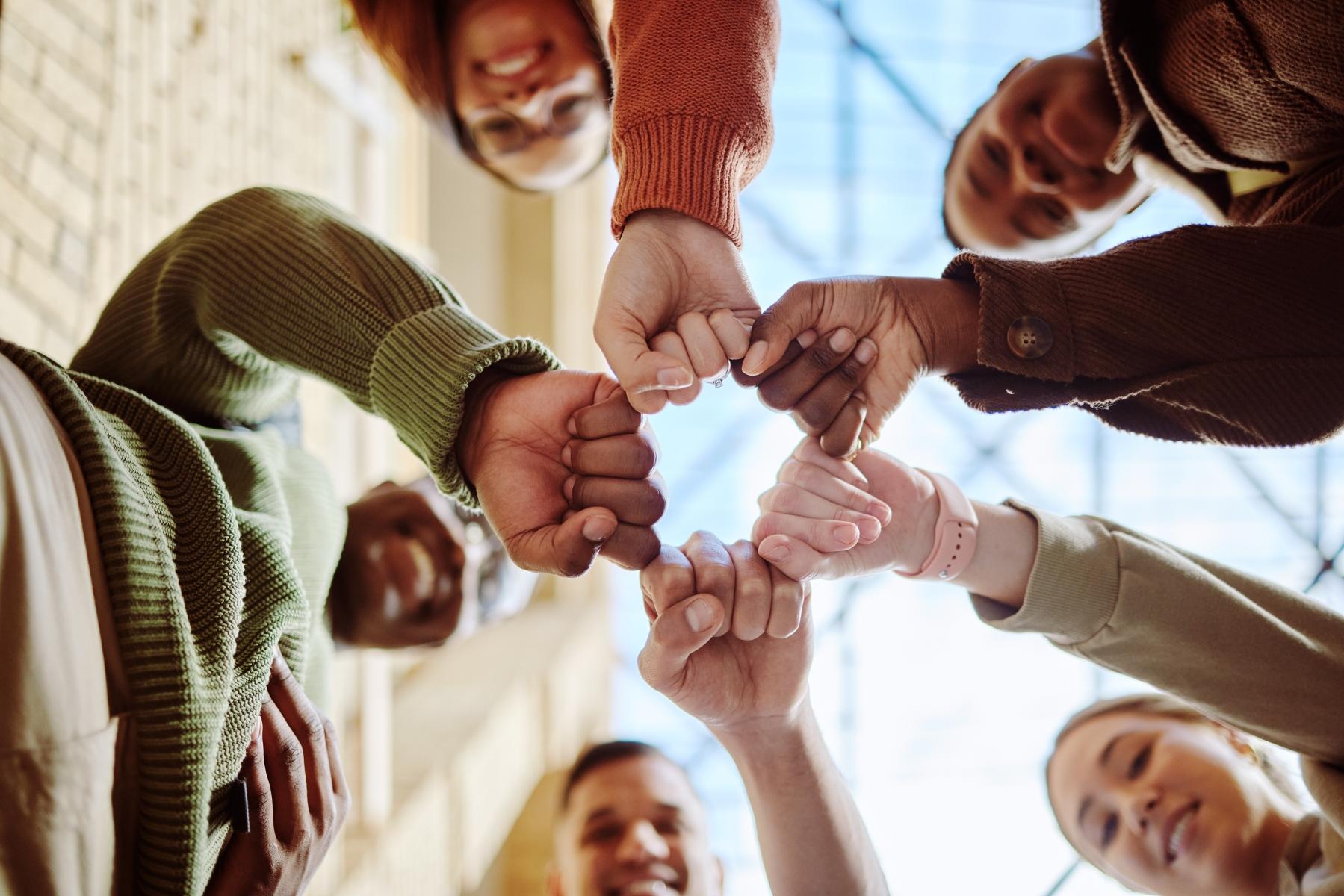 59658081-below-students-and-fist-hands-in-group-for-support.jpg