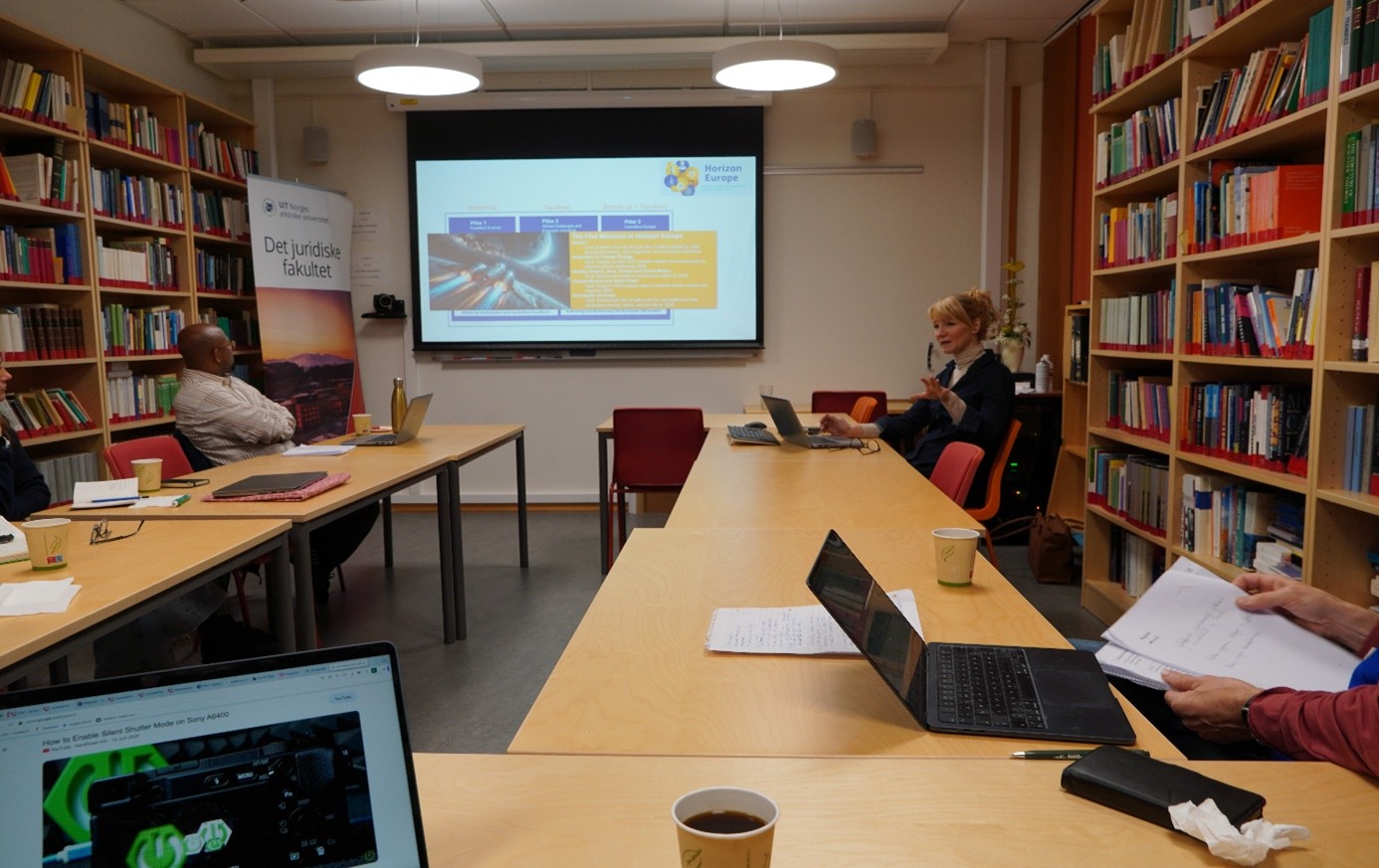 Therese Mikalsen holding her presentation while the group is listening